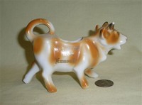 Exmouth souvenir cow creamer, right