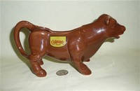 Colman's mustard advertising cow creamer, right