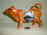 Jersey souvenir cow creamer, left