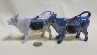 Two German lustre souvenir cow creamers from Guernsey