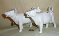 Two matte white Goebel cow creamers
