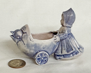 blue girl pushing bird faces carriage