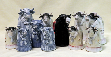 A small herd of S&V standing lady in a dress cow creamers