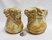 Light brown bull and cow buffalo head creamers