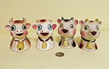 4 big eyed Japanese cow head creamers