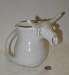 Bull head pitcher with brokemn hrn