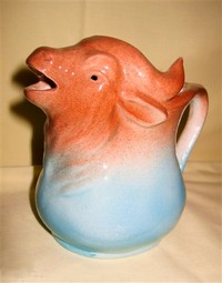 Blue and orange buffalo head creamer