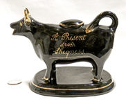 Jackfield souvenir cow creamer from Skegness