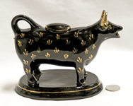 Jackfield souvenir cow creamer from Skegness