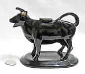 Jackfield cow creamer with horns pointed forward