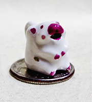 Miniature cow creamer with big red nose