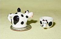 Cow teapot and cup feves