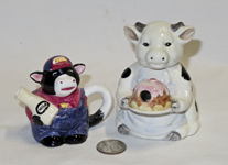 Two miniature cow teapots