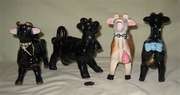 Four Elsie 'knock-off' cow creamers
