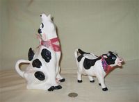 Two 'Desert Doodads' cow creamers