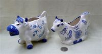 Norcrest and Arnart blue and white cow creamers