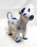 Heavy clay US folk art cow creamer, front