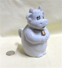 Standing white cow creamer missing some cold paint