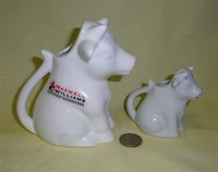 Australian and Dansk white sitting up cow creamers