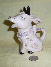Sitting up Japaese purple cow creamer with flowers