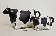 Large and small Sakura B&W cow creamners