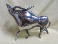 stylized metal bull pitcher