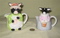 two girl cow pitchers