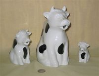 Stonewall Kitchen cow pitcher and two creamers