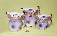 3 purple matching Japanese cow caricature pitchers