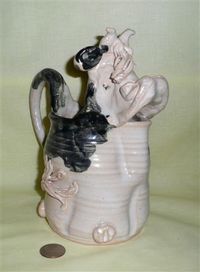 Grey hand thrown cow pitcher