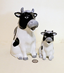 Henriuckson imports cow pitcher and creamer with greyk noses 