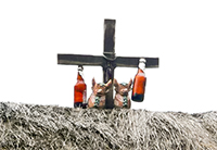 Torito de Pucara and bottles on Peruvian thatch roof