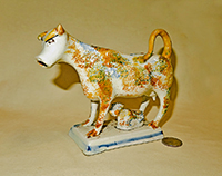 Multi-colored sponge painted cow creamer