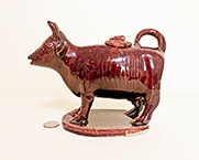 Unusually shaped Rockingham glaze cow creamer, side 