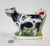 Similar Spill vase cow creamer, front