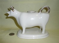 White cow creamer with gilt