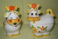 Orange nosed cow caricature creamer and sugar