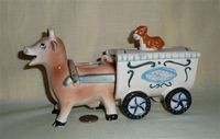 Cow creamer pulling wagon sugar