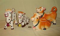 Polka dot and brown UCAGCA cow creamers and sugars