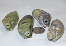 Four small Chinese soapstone suiteki of water buffalo