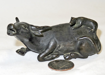 Japanese bronze
bull suiteki with animal on rump