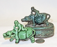 Two green suiteki of man on water buffalo