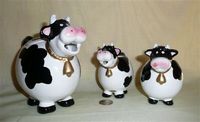 Pudgy caricature cow teapot set