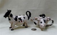 Two small fake collector's cow teapots by Nini