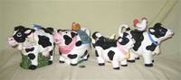 4 cow teapots  