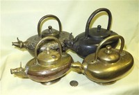 Four Indian cow headed ghee pots