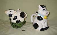 Cow tea for one and sitting cow teapots