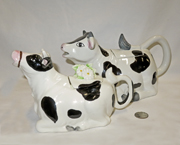 Two lying down cow teapots