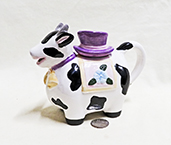 Cow teapot with purple hat lid