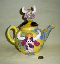 Homemade teapot with bull heads, right